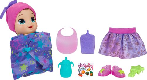 Includes doll with attached onesie, swaddle blanket, bottle, food pouch, bib, hat, brush, skirt, shoes and instructions. For ages 3+ WARNING: Small parts may be generated. Note: Adult should remove and discard fasteners/packaging components. SURFACE CLEAN ONLY